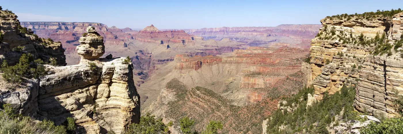 Grand Canyon South Rim ultra-wide panoramic view of canyon spires and layered buttes stretching to the horizon